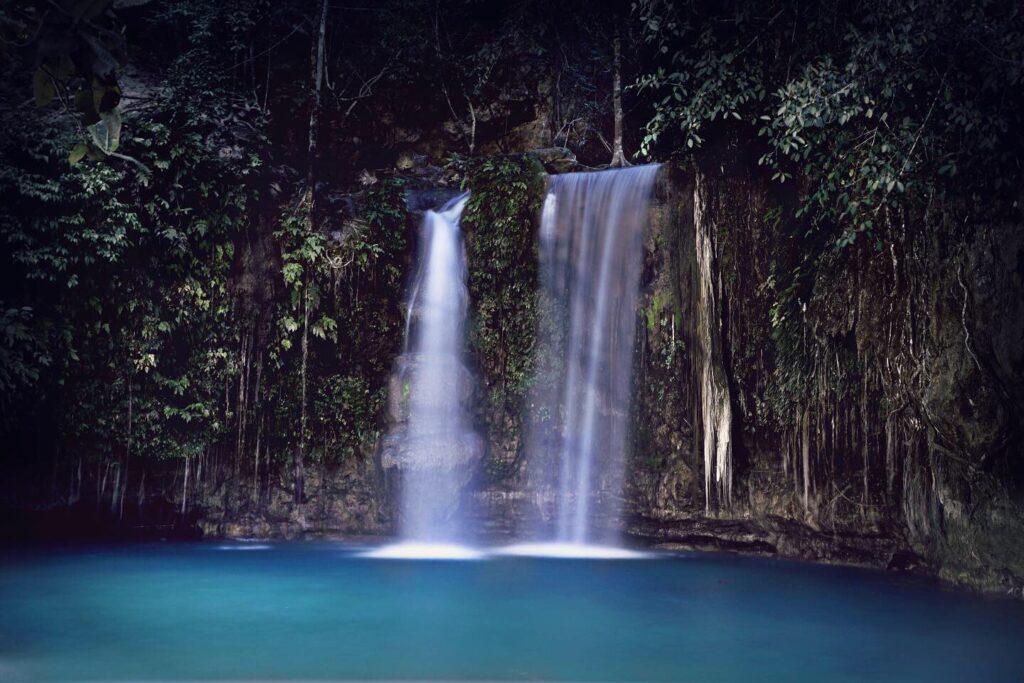 The last big jump of the canyoneering route, into Kawasan's blue pool