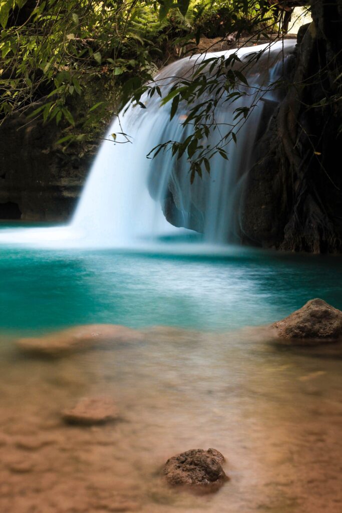 Turquoise river and small cascades in the canyon
