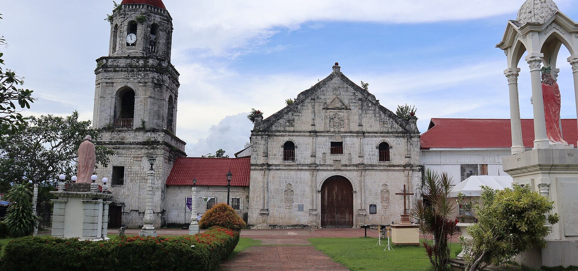 The coral stone facade and bell tower of St. Michael the Archangel Church in Argao