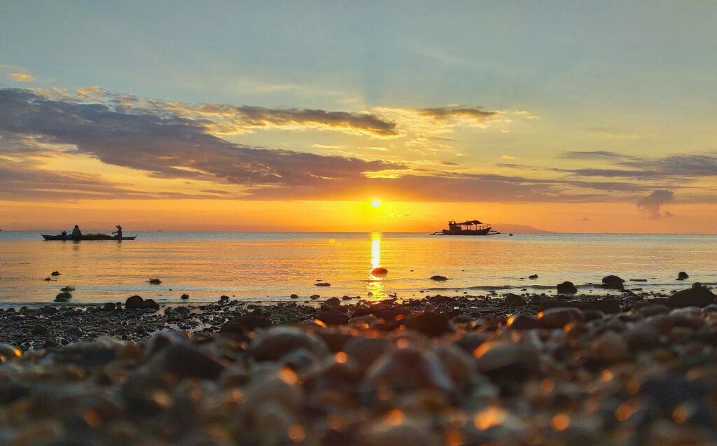 Sunrise over the pebble shore of Argao