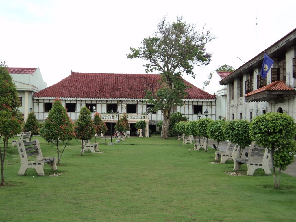 Argao's Spanish-era town hall across the tree-lined plaza