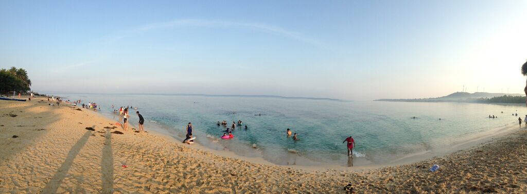 Fine pale sand and calm water on a Pagudpud beach