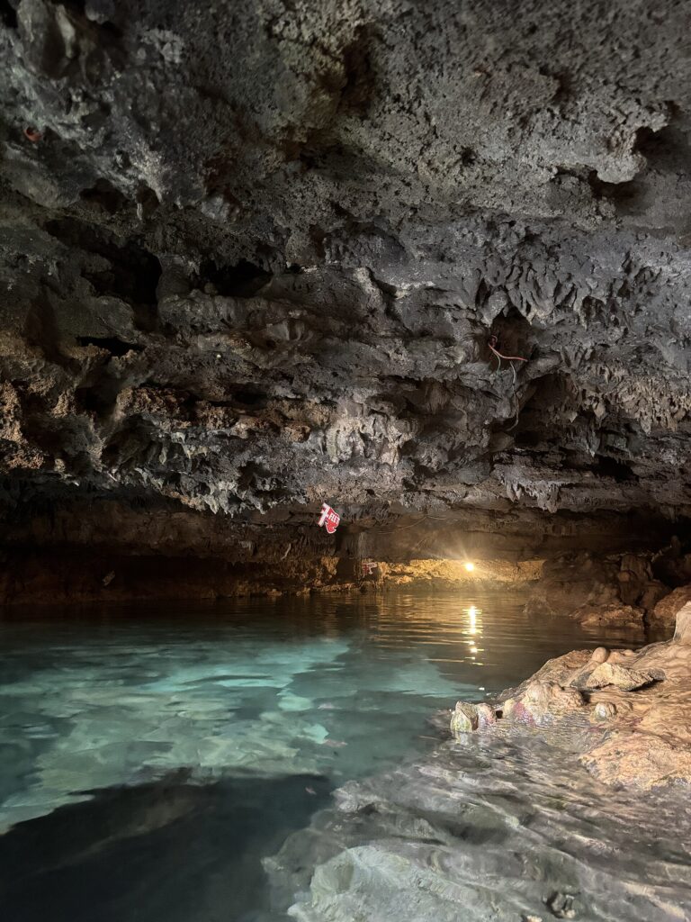 The turquoise natural pool inside Ogtong Cave, Santa Fe