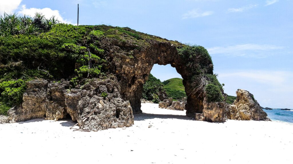 The Ahaw rock arch on white-sand Morong (Nakabuang) Beach, Sabtang