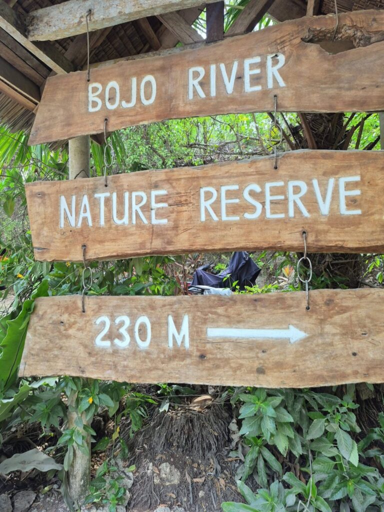 Wooden signs reading Bojo River Nature Reserve, 230 m