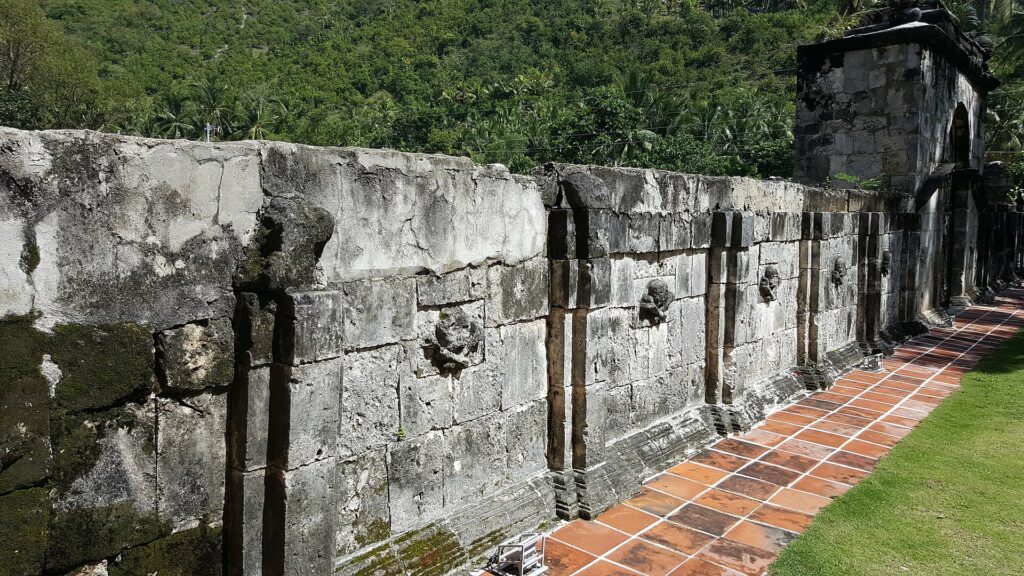 Arched coral-stone wall of Boljoon's Spanish-era cemetery