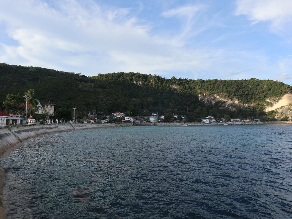Boljoon's calm bay and green hills from the town proper
