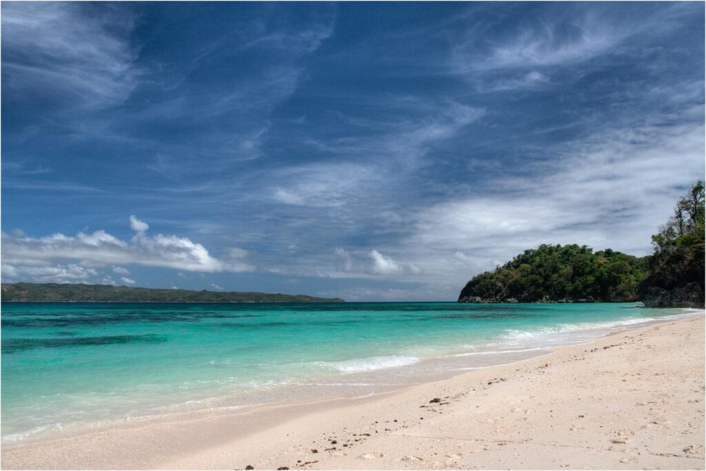 Clear turquoise water at Puka Beach on the island's quieter north end