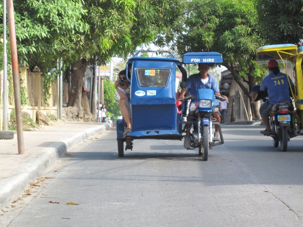 Tricycles on the island's main road, the usual way to get around