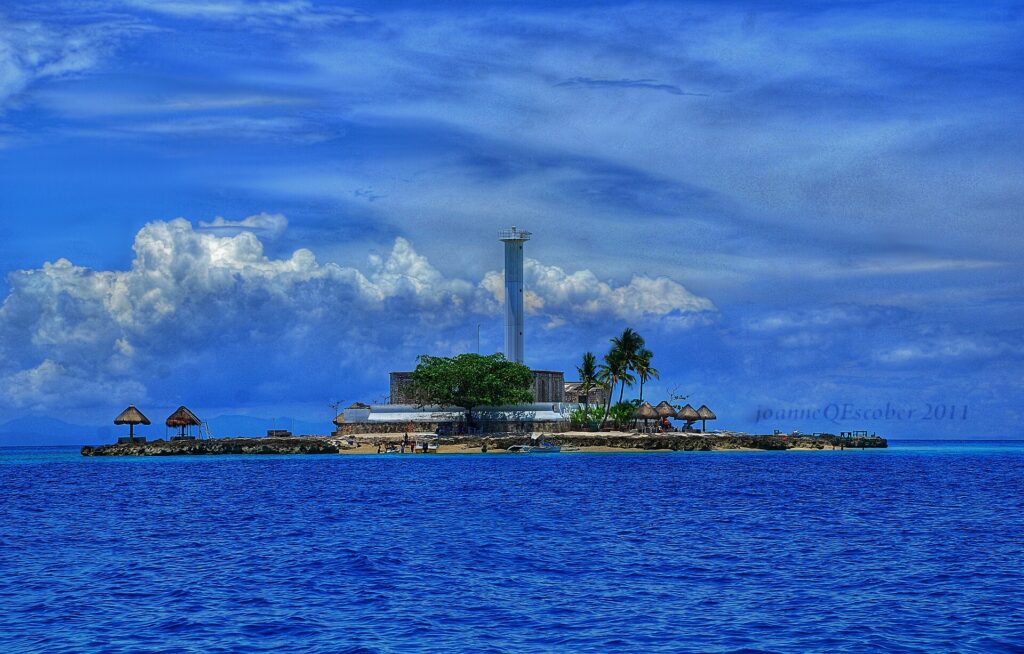 The whole islet under a big blue sky