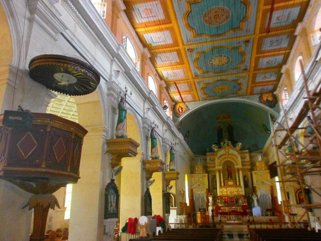 Painted ceiling, pulpit and gilded altar inside Carcar Church
