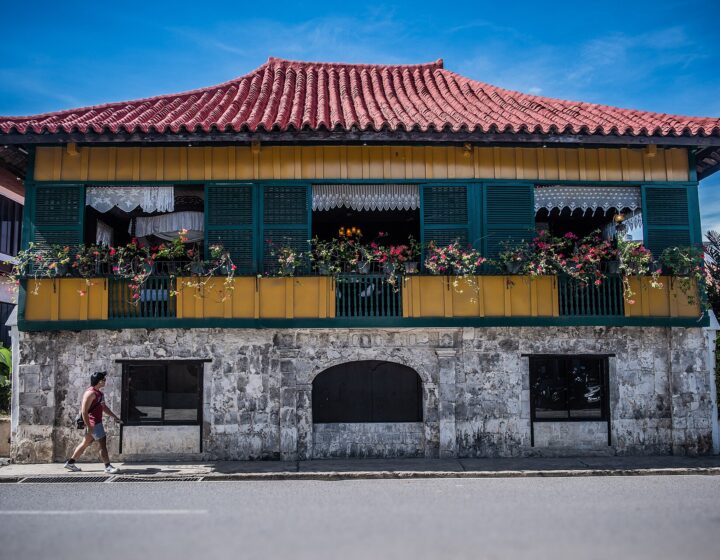 The red-tiled two-storey Casa Gorordo with its stone ground floor and flower boxes on the upper windows