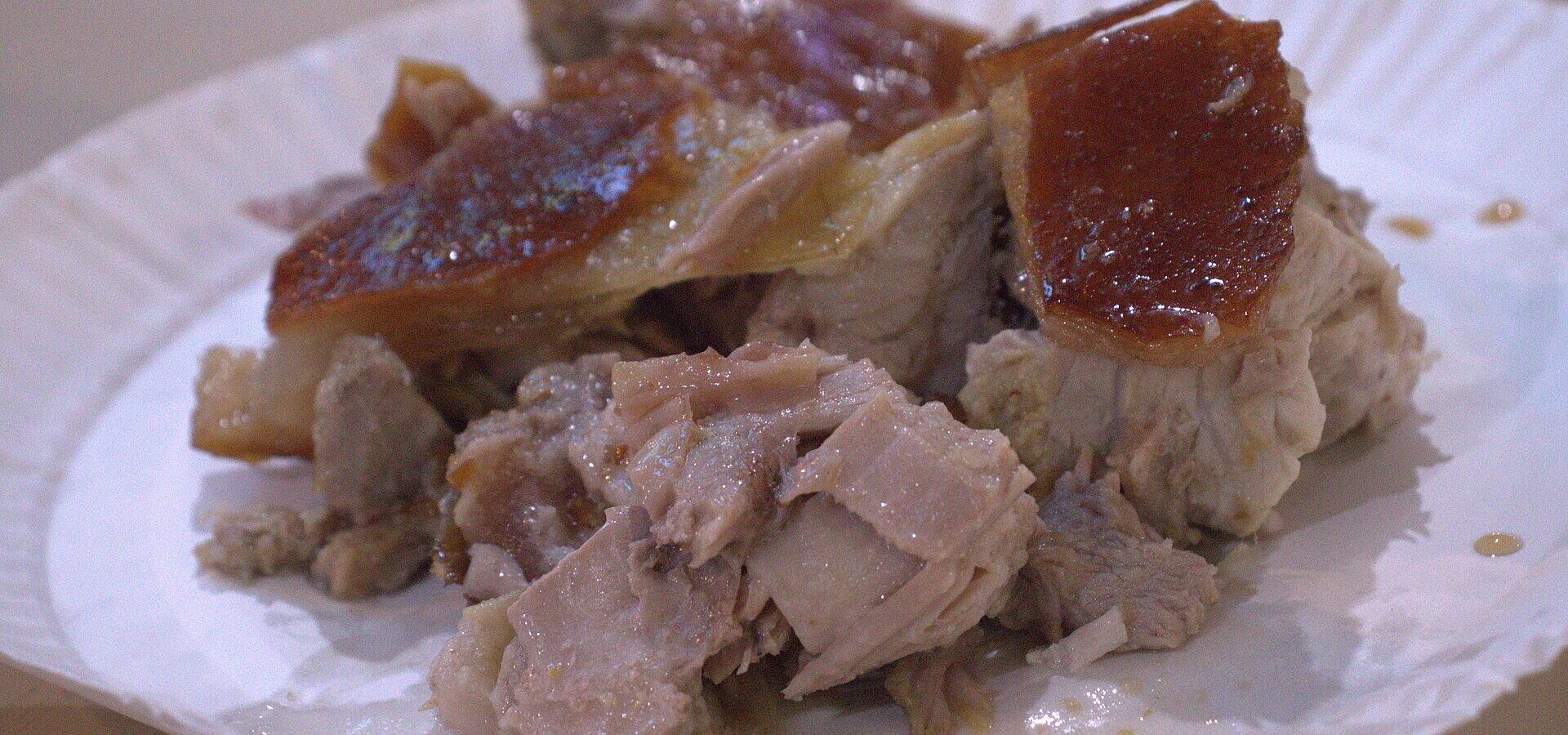 A plate of Cebu lechon with crispy skin and tender meat in Cebu City