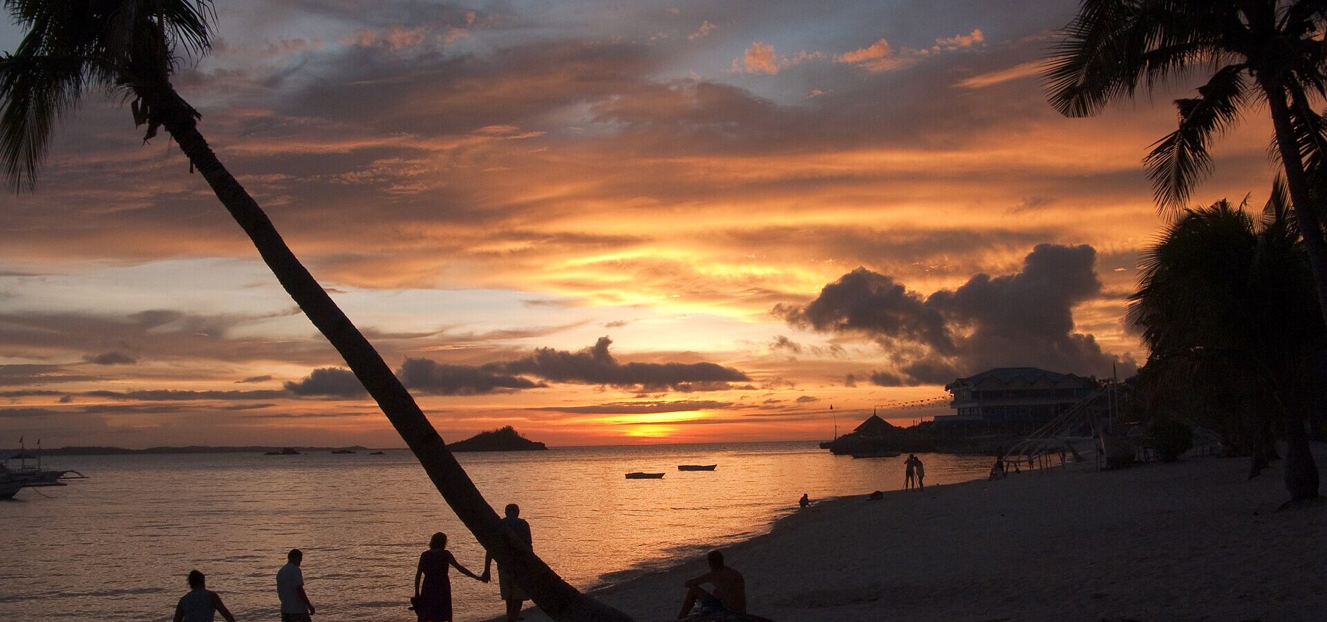 Sunset on the beach with palms, Malapascua Island