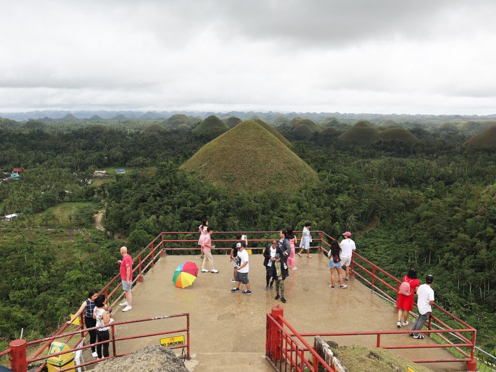 Visitors on the hilltop viewing deck at the Chocolate Hills Complex, Carmen