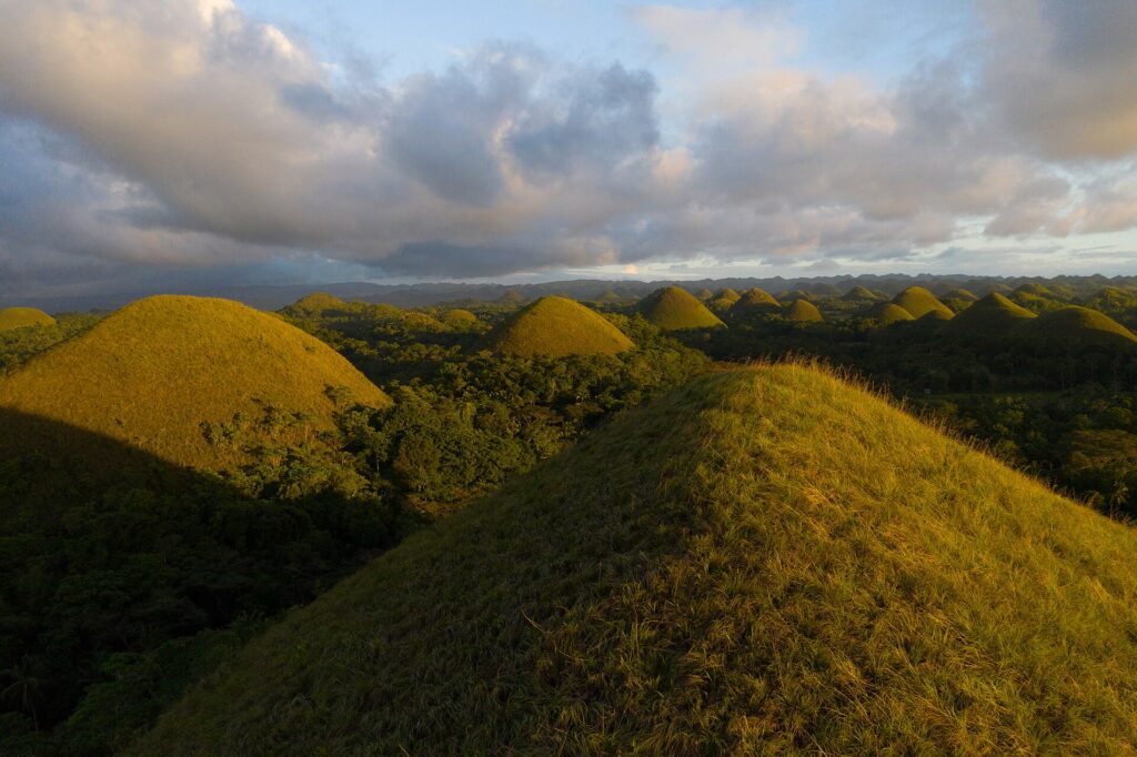 Warm late-afternoon light across the brown hills of Carmen