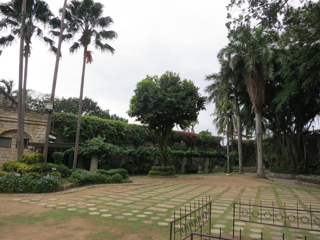 The garden courtyard inside the fort, framed by palms