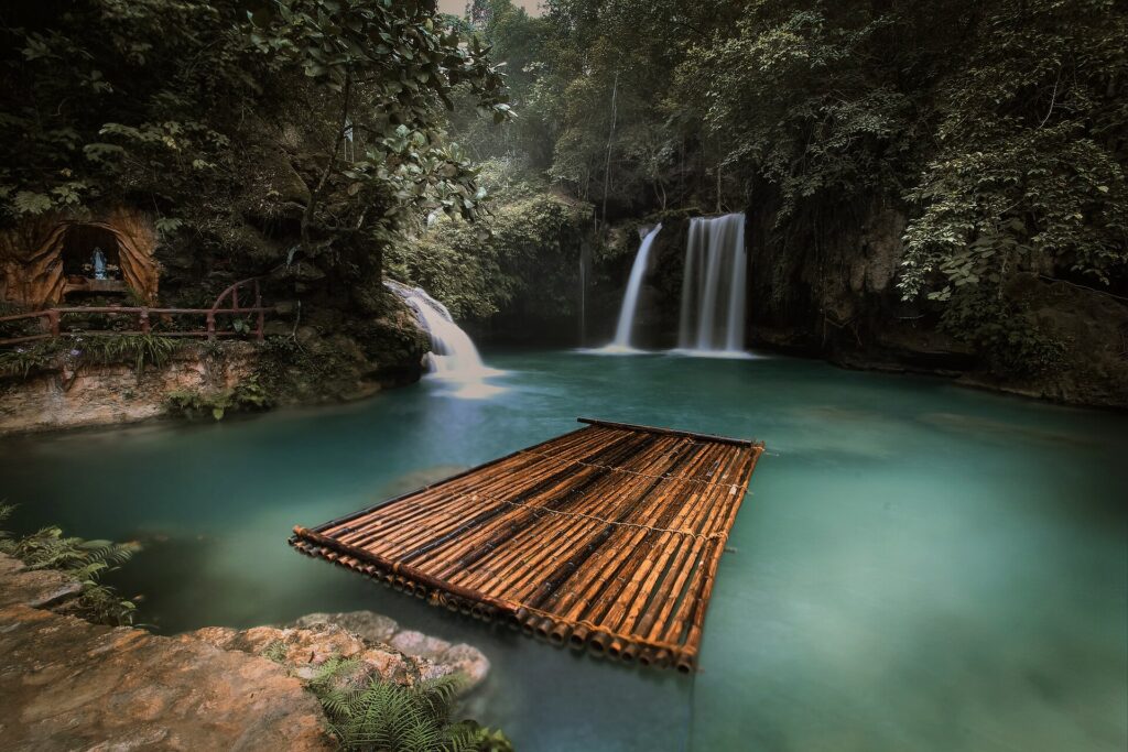 A bamboo raft on the pool below Kawasan Falls