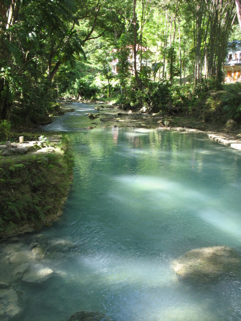 The shimmering Kawasan River on the walk up to the falls