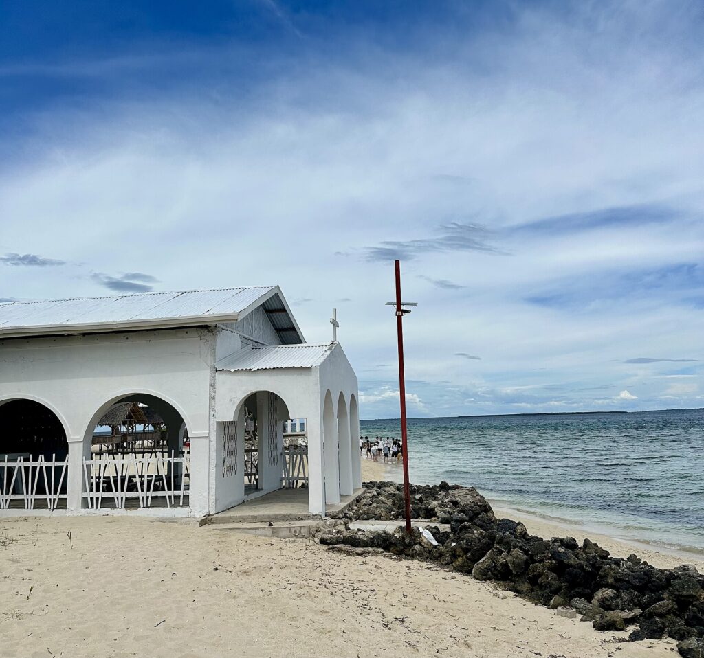 A small white chapel on the shore of Pandanon Island