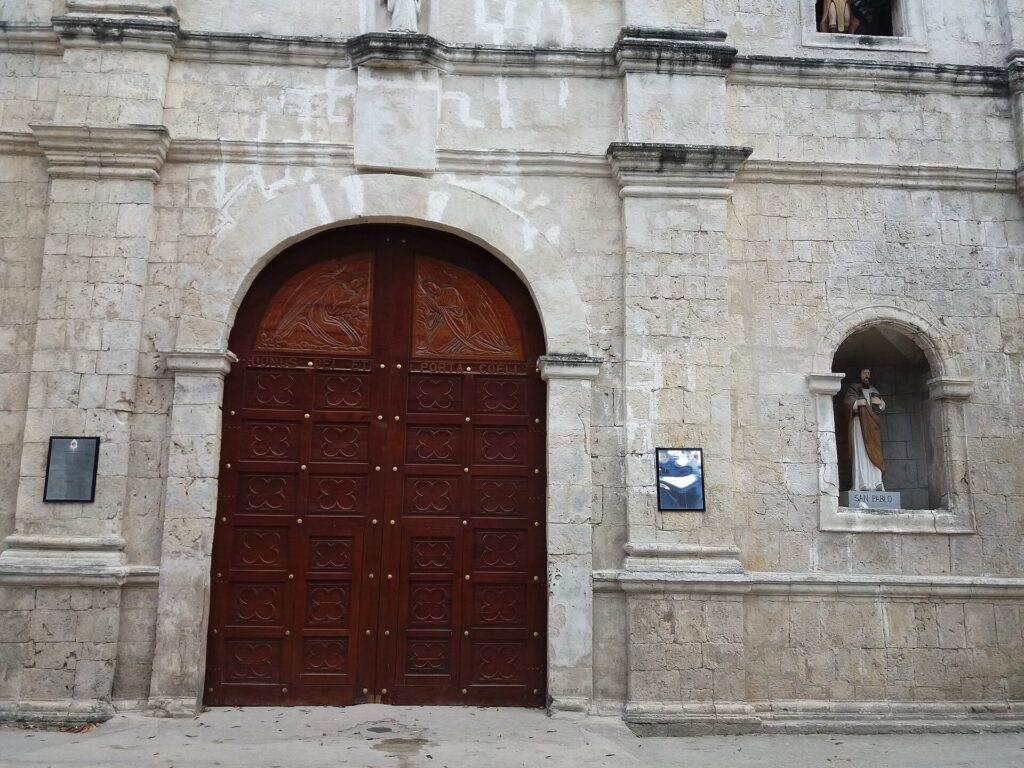 The main door of the old church in Malabuyoc