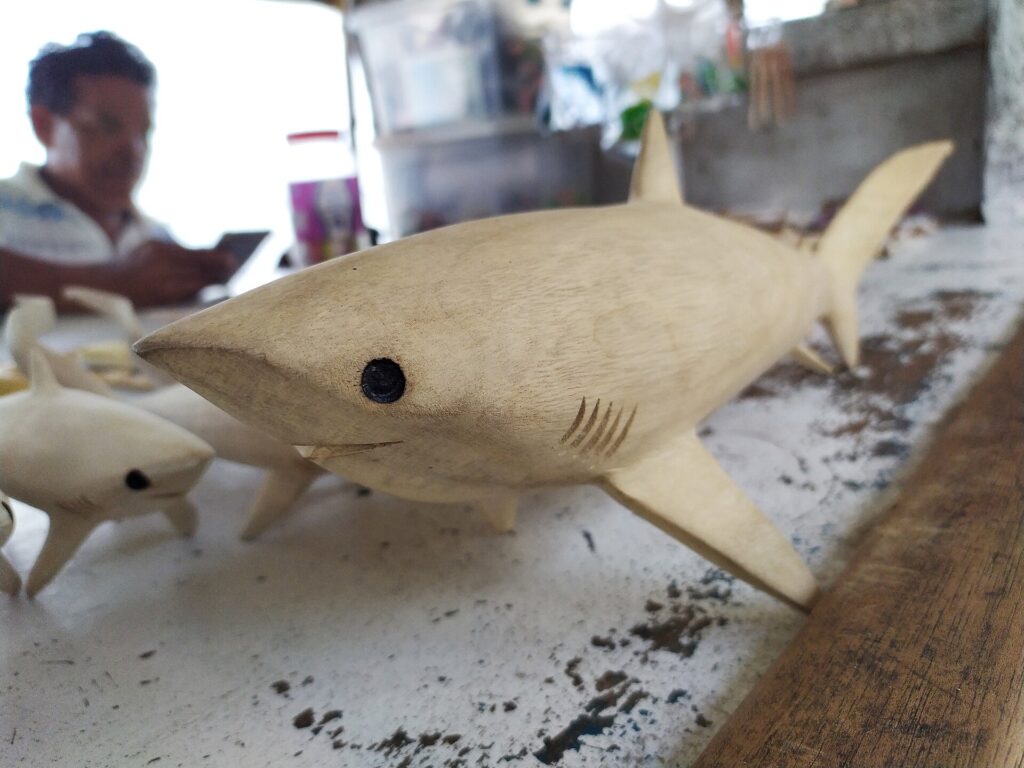 A wood carving of the famous thresher shark, a Malapascua souvenir