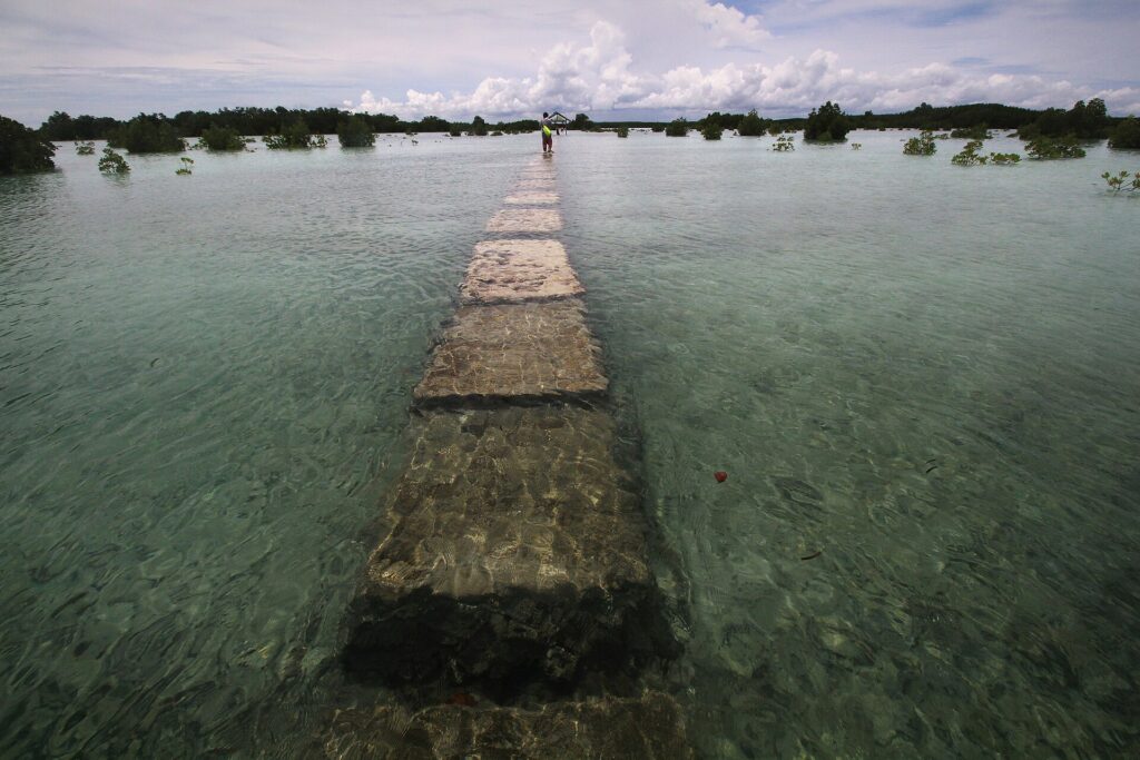 A stone footway leading out over the tidal flats