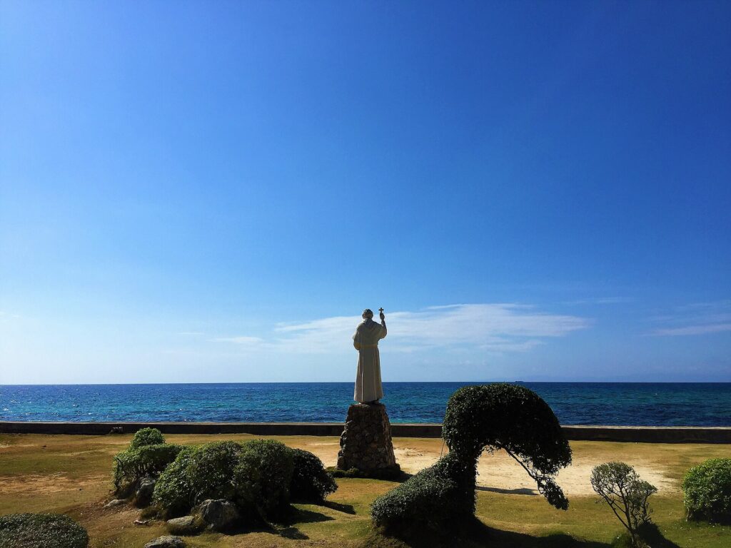 Fr. Julian Bermejo statue looking out to sea in the Heritage Park