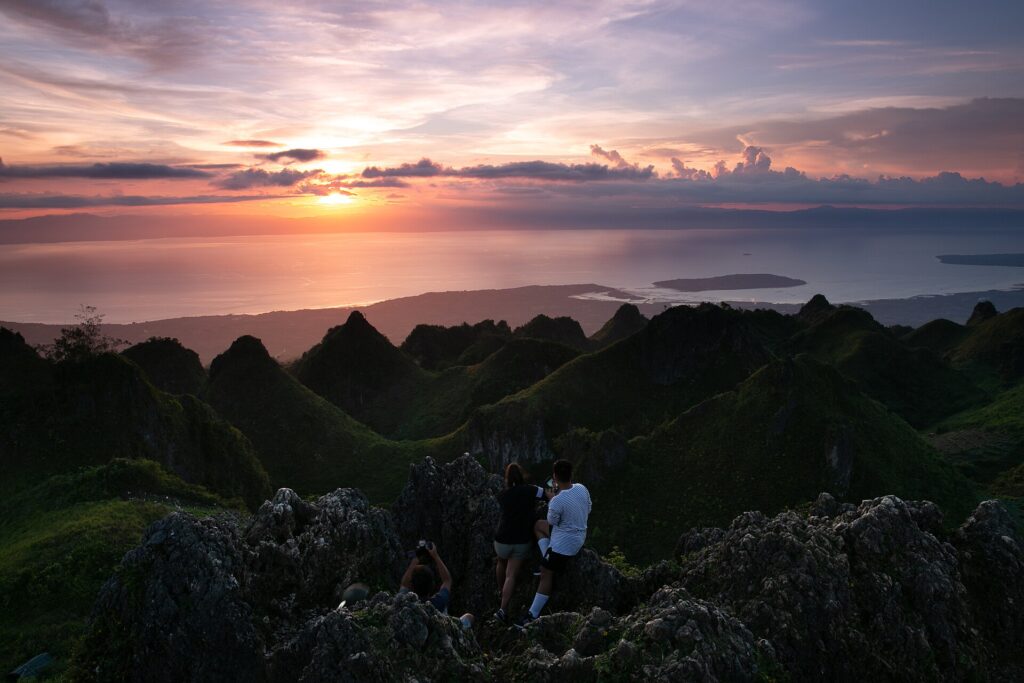 Sunset over the jagged hills from the top of Osmeña Peak