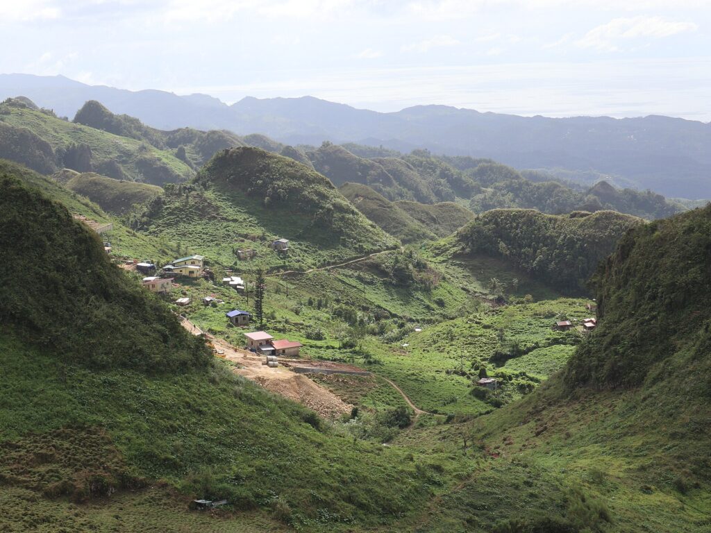 Vegetable farms in the valley below the peak