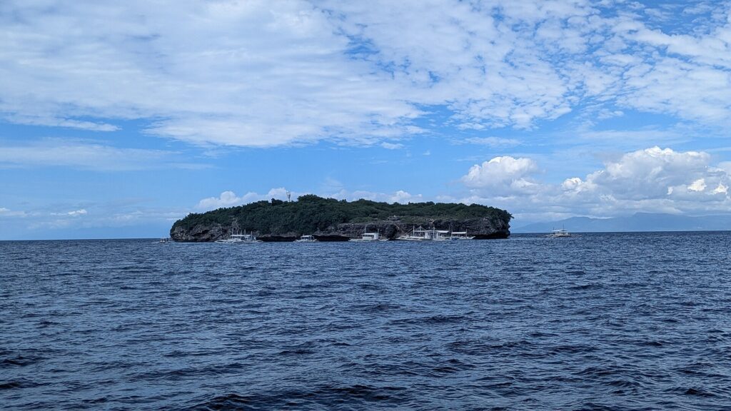 Pescador Island on the horizon as the boat heads out from Moalboal