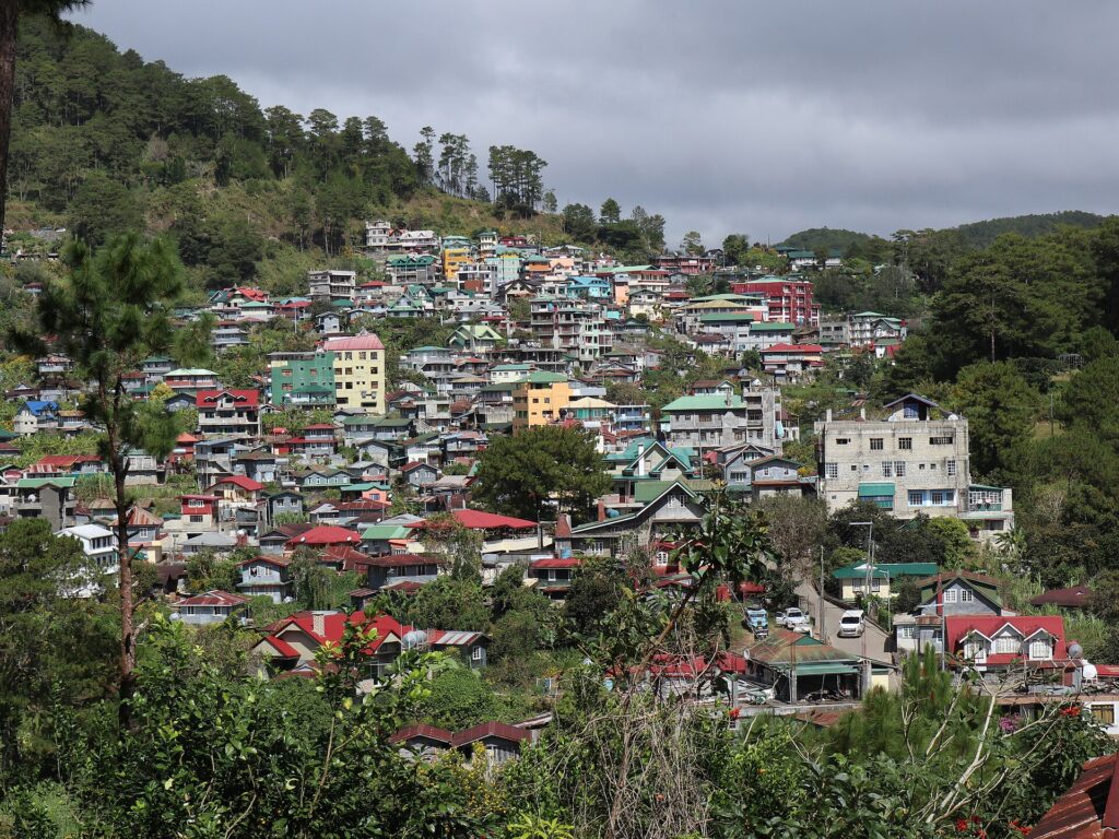 Houses of Sagada town spread across the pine-covered hillside