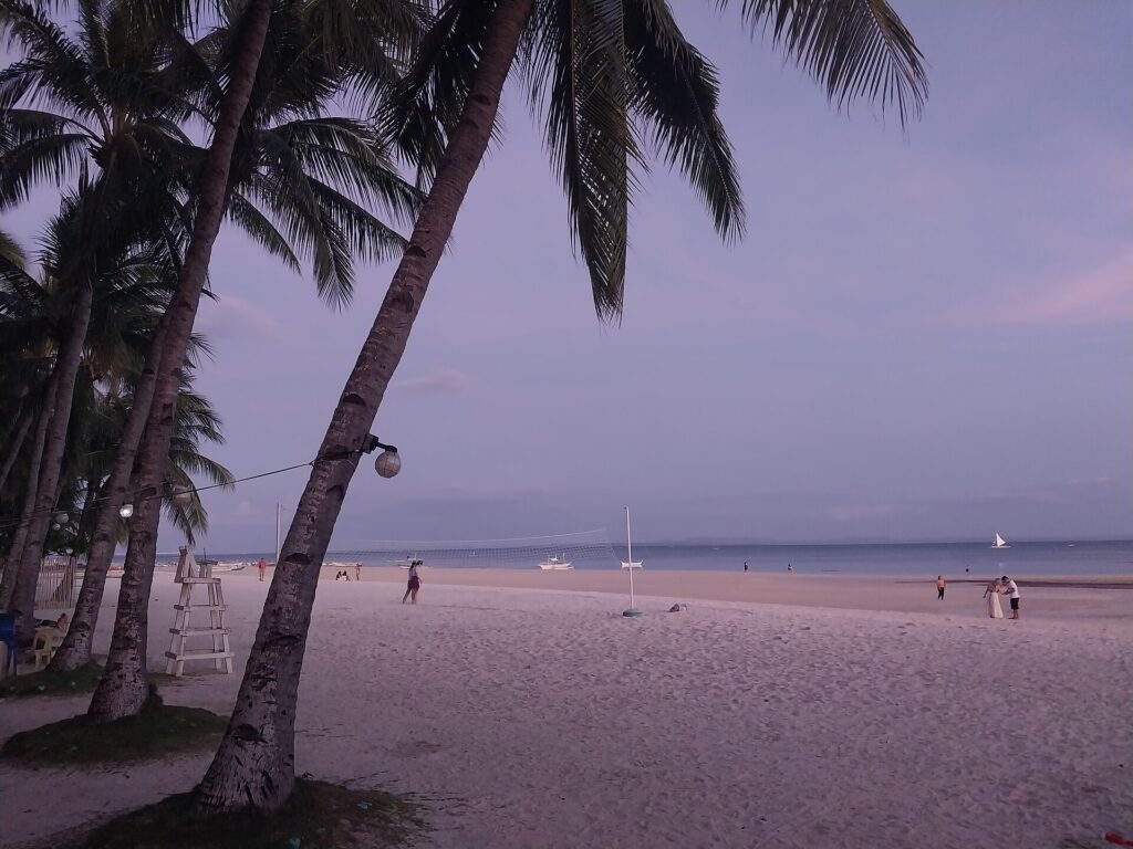 A calm stretch of white-sand beach on Bantayan Island