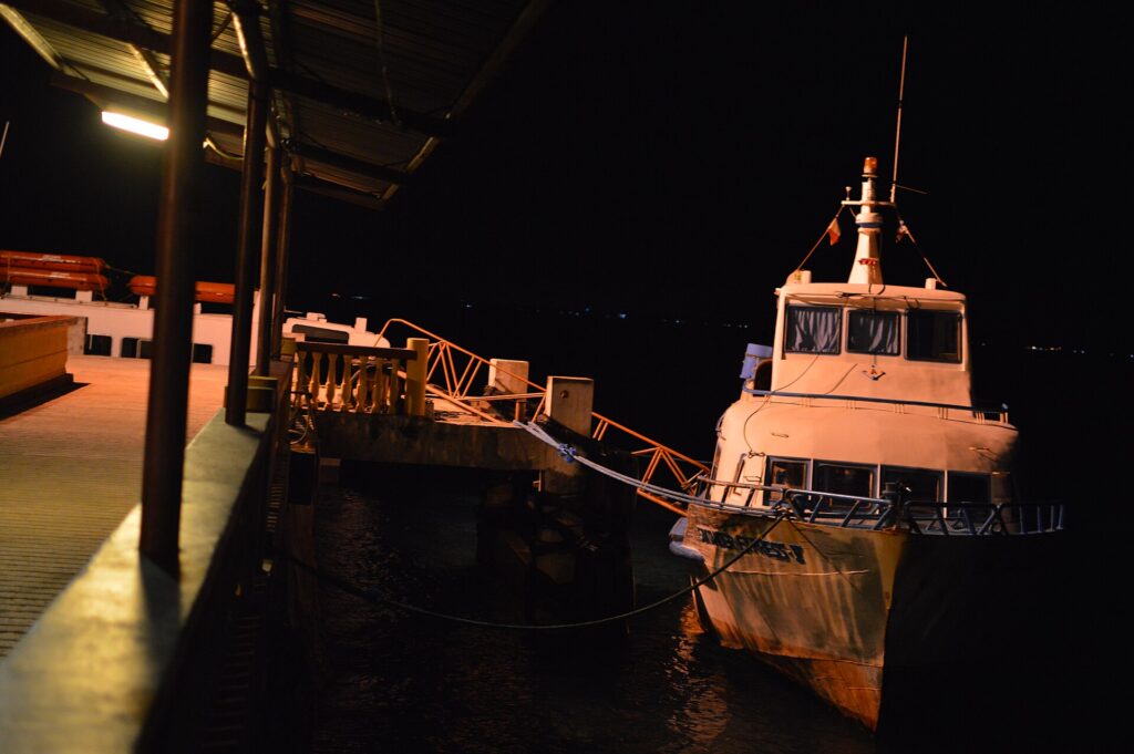 A fast craft moored at Liloan port in Santander at night