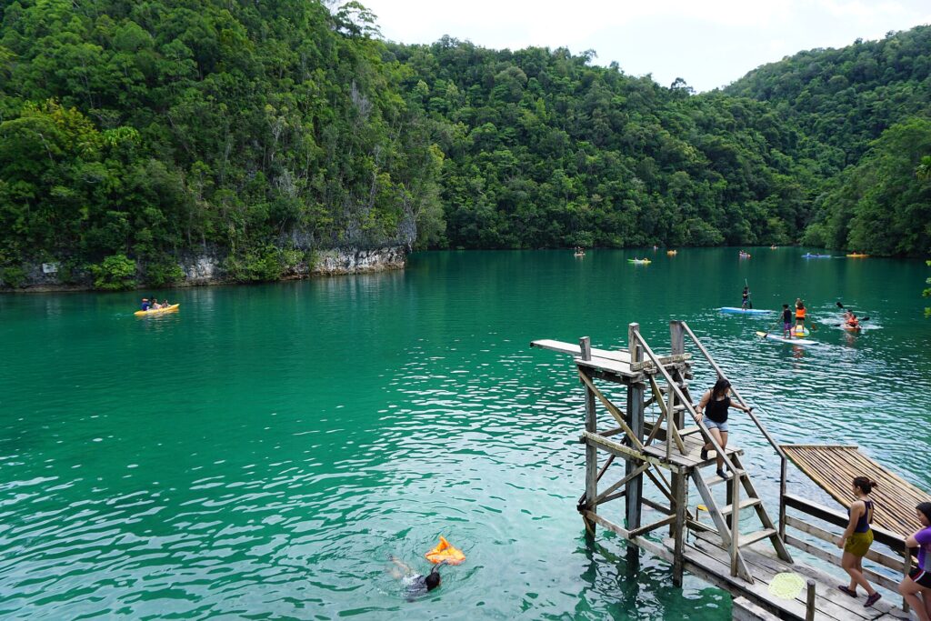 Emerald water and the jump-off platform at Sugba Lagoon, Del Carmen