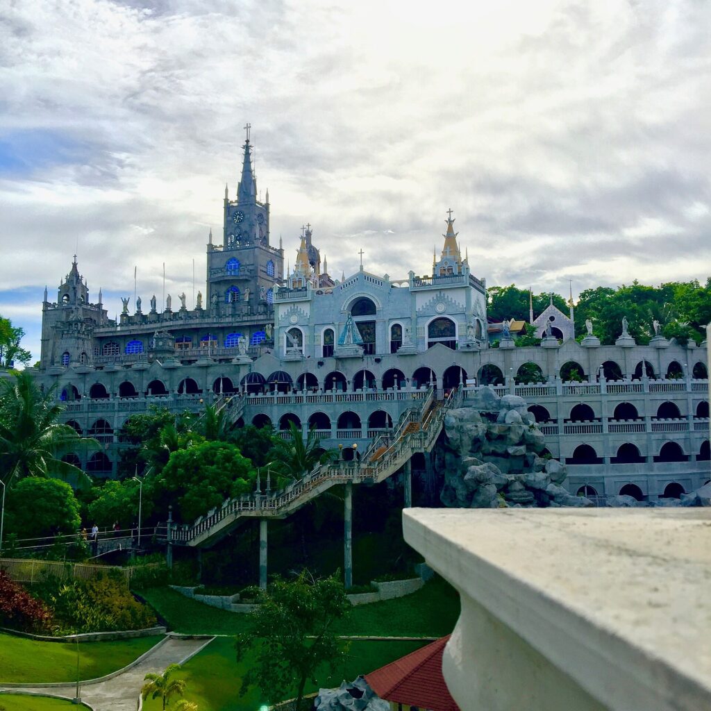 The castle-like Simala Shrine rising above its terraced gardens
