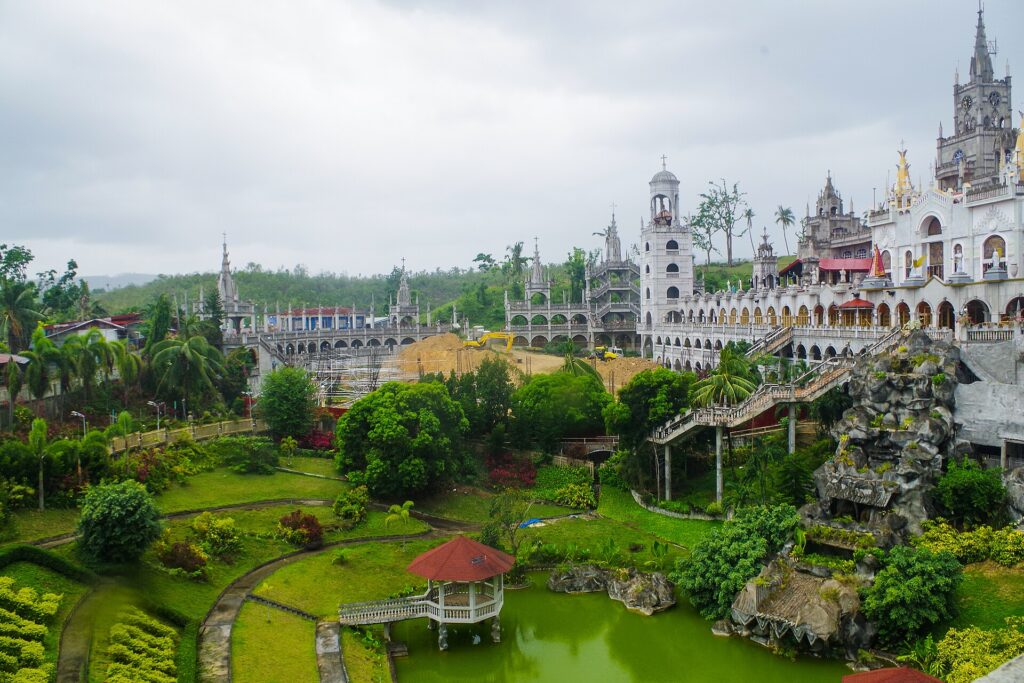 Simala Shrine seen across its green gardens and pond