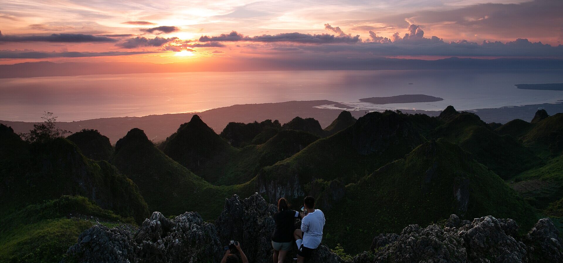 Golden light over the jagged hills of Osmeña Peak in Dalaguete, Cebu