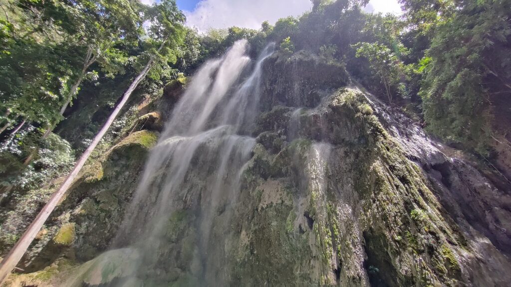 Limestone formations and the falls seen from the pool