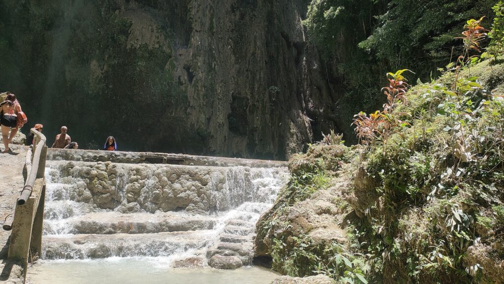 Stepped stone cascades beside the path